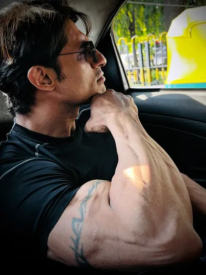 Another angle of my arm, showing the bicep peak and forearm development.