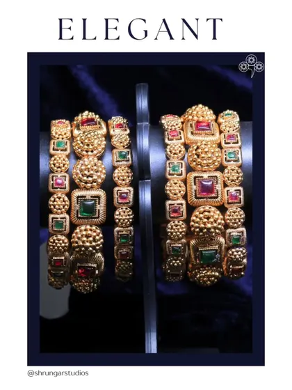 These elegant and heavy bangles with multi-colored stones are perfect for a bride.
