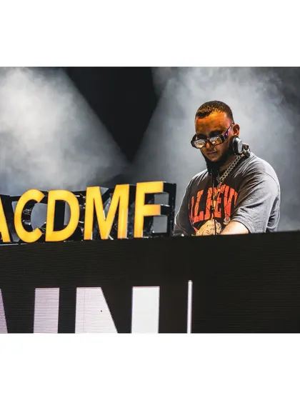On the decks at the Artist Connect Dance Music Festival (ACDMF). This event brings together top DJs for a massive celebration of dance music.