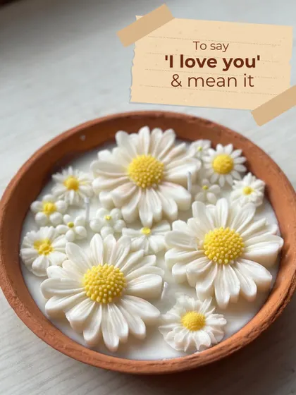 To say 'I love you' and mean it. This terracotta bowl filled with a garden of wax daisies is a beautiful and unique way to express your love.