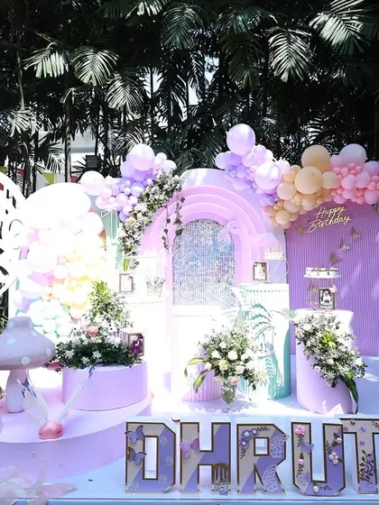 The butterfly theme is a favorite for parents blessed with a princess, and I've lost count of how many I've designed. Each time, it turns out uniquely cute, like this enchanting setup for Dhruthi.