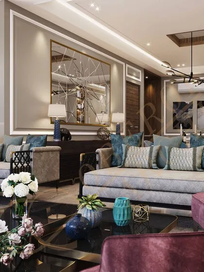 A pop of color from the velvet armchair and throw pillows adds personality and vibrancy to the neutral living space.