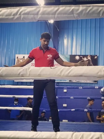 Separating the fighters during a break in the action. Maintaining control of the ring is essential for a clean fight.