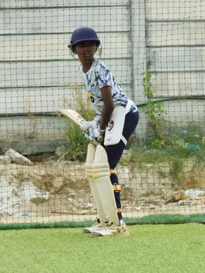 A perfect side profile of a young batter's stance. This photo highlights the correct posture and balance we teach our students during their cricket training sessions.