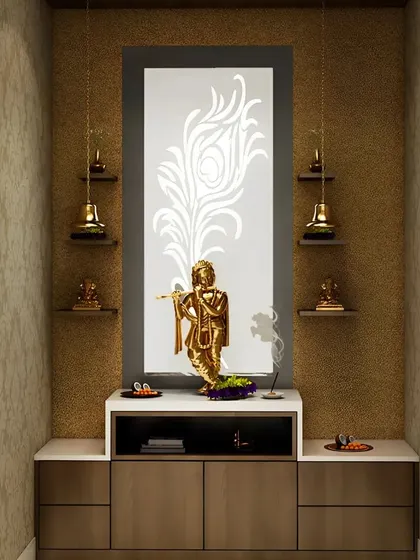 We created this serene prayer nook dedicated to Lord Krishna. The design features a backlit panel with a laser-cut peacock feather motif, symbolizing the deity, along with floating shelves and hanging bells to complete the devotional theme.
