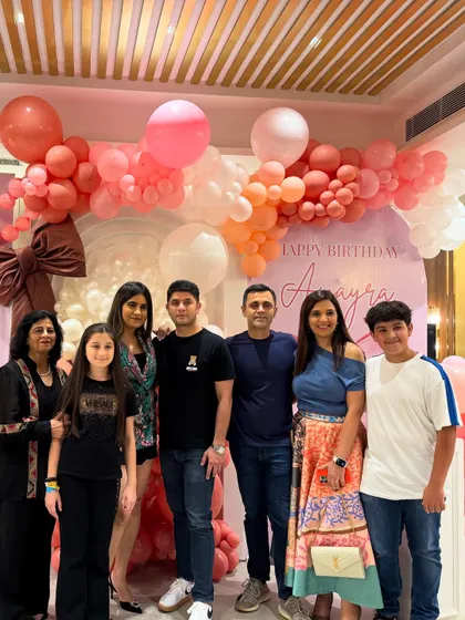 A group photo of family and friends celebrating together.