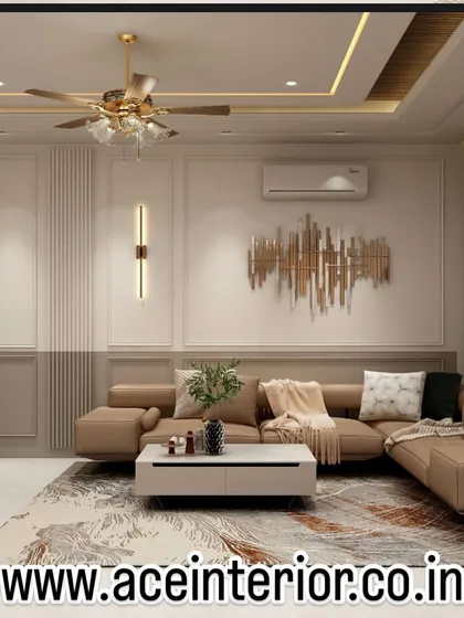 This living room demonstrates our approach to creating comfortable and elegant spaces. We combined a plush sectional sofa with refined wall molding, modern art, and a statement wall sconce to achieve a balanced and inviting atmosphere.