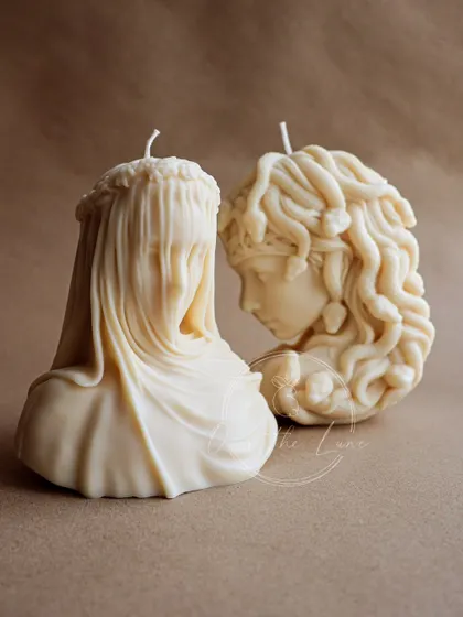 The Veiled Lady and Medusa, two powerful female figures from my Olympia collection, side by side. Both are carved with incredible detail from my vegan soy wax blend.