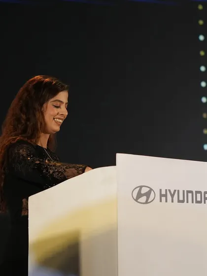 A smiling moment on stage for Hyundai. I believe a positive and approachable demeanor is essential for keeping the audience engaged.