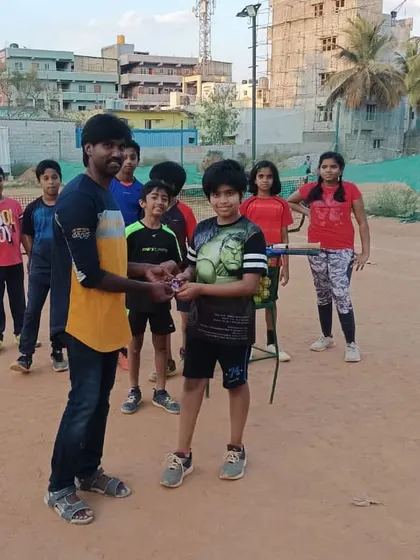 Presenting the 'Player of the Week' award to Arjun. This simple act celebrates dedication and serves as a great motivator for all the students in our junior tennis program.
