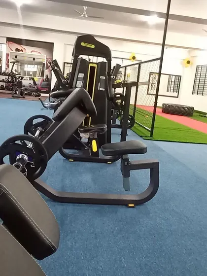 We invest in high-quality, ergonomic machines like this preacher curl bench to help you target specific muscle groups safely and effectively.