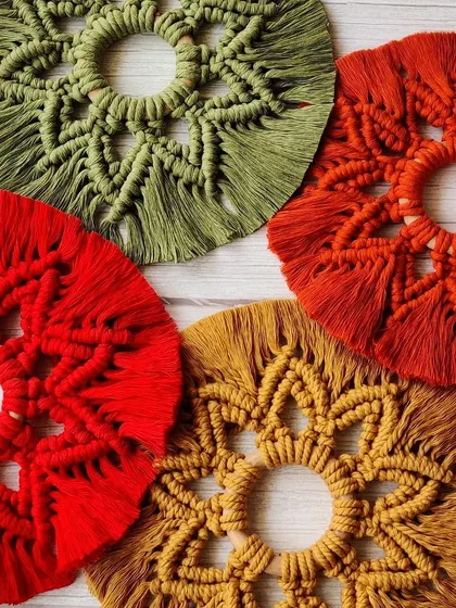 A top-down view of the unlit star-patterned macrame holders, showing the intricate knot work.
