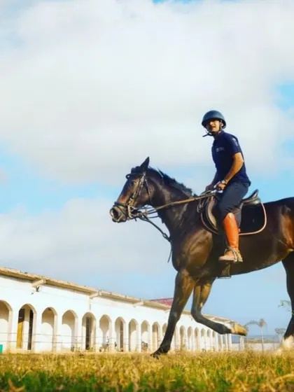 A rider and horse move in unison, a testament to the strong partnership developed through our training methods.