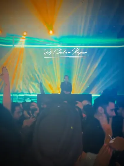 Even a blurry shot can't hide the incredible vibe of the night. The mix of lights and a packed crowd captures the raw, unfiltered energy of a great wedding party.