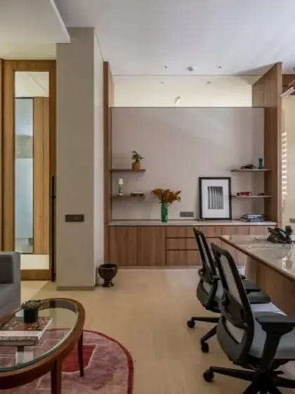 This office blends modern furniture with classic details like wall paneling and traditional art. The result is a timeless and sophisticated space that feels both powerful and comfortable.