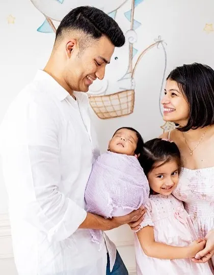 A beautiful family of four celebrating their newest member. I love capturing these moments against the backdrop of your baby's own nursery.
