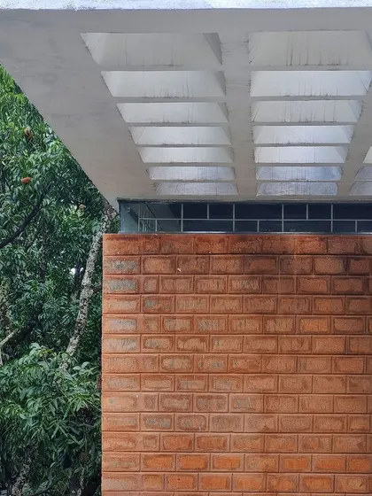 A detail of a coffered slab ceiling and an exposed brick wall at the 'AGA' site.