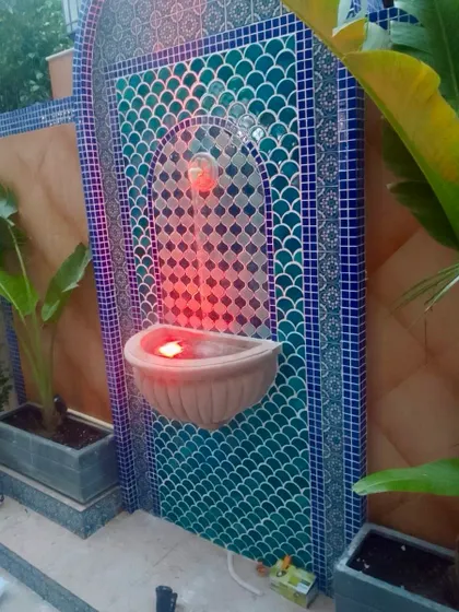 A Moroccan garden I made in a courtyard of a Defence Colony villa. The centerpiece is this beautiful wall fountain, with its intricate blue and green tilework and a warm, inviting light.