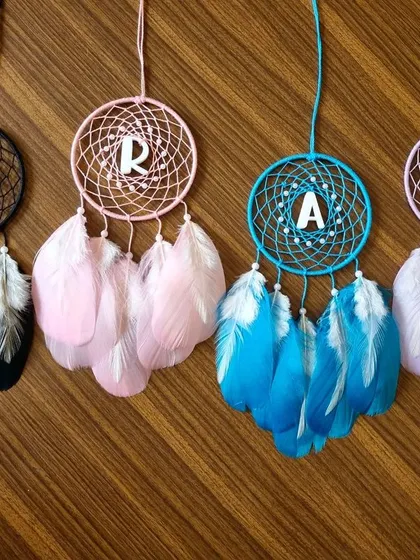 Personalized car hanging dreamcatchers with initials 'K', 'R', 'A', and 'S'. These make fantastic, custom return gifts for any event, allowing each guest to receive a personal token.