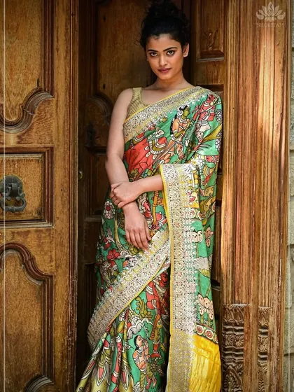 Here is one of my favorite Pen Kalamkari sarees, worn to show its true artistic flair. The fabric becomes a canvas for mythological stories, hand-painted with natural dyes. This saree is a piece of wearable art, blending traditional craft with contemporary style.