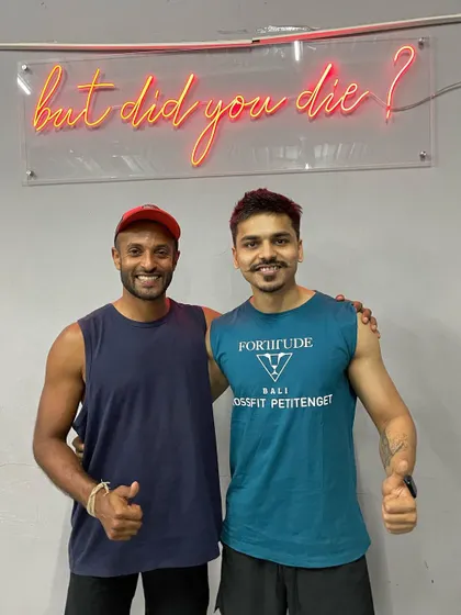 Posing with the instructor after our Thai massage workshop. Continuous learning is a huge part of my philosophy as a coach.
