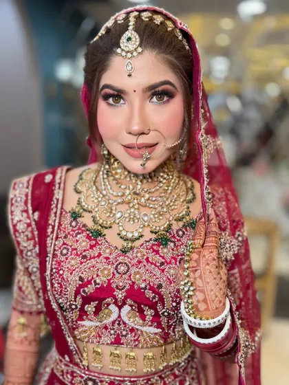 This bride is all smiles, looking absolutely radiant. The makeup enhances her natural beauty, making her look and feel like the best version of herself.