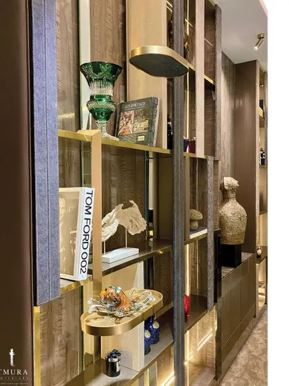 We design shelving that is both for storage and display. This custom unit features integrated lighting and a unique rotating shelf, perfect for showcasing curated books and artifacts.