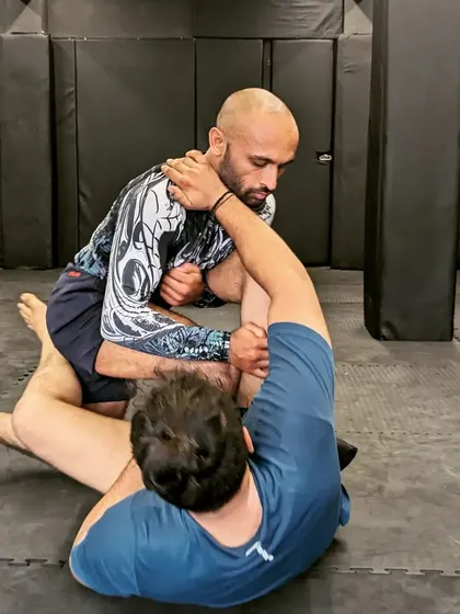 Working to break the grip and escape a submission attempt. Our training covers both offensive and defensive aspects of grappling to create well-rounded fighters.