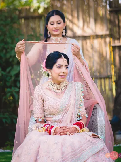 The final touches. A loved one helps the bride, Ratika, with her veil, a classic getting-ready shot.