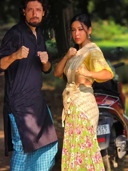 Ready for action, even in a village setting. This pose captures the "South movie" vibe, showing how I can adapt my performance style to different genres, blending traditional attire with a fighting stance.