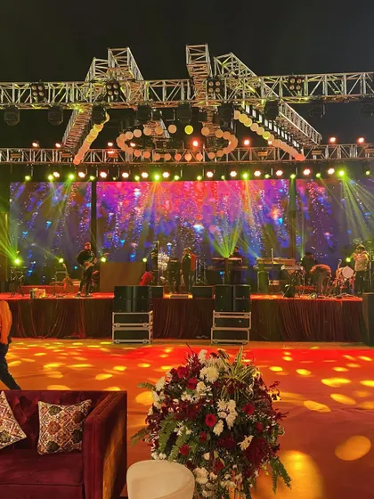 The stage is set for an unforgettable performance at a royal wedding reception. I handle the complete production, including the complex trussing, dynamic lighting, and large-scale LED screens required for a concert-level entertainment experience.