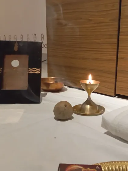 A single flame and an offering. In this consecrated space, even the simplest acts become a way to connect and express our gratitude.