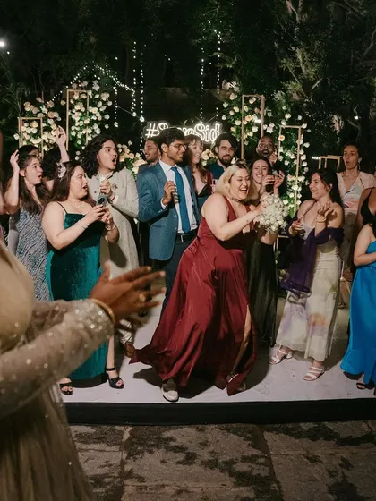 The bouquet toss, a fun tradition that gets all the single ladies on the dance floor. It's a moment of excitement and anticipation that adds to the party atmosphere.