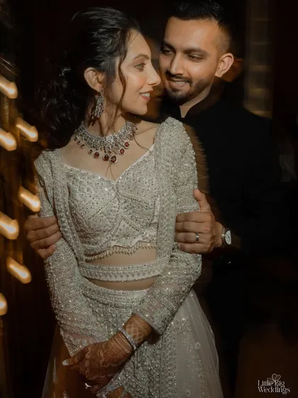 An intimate portrait of a couple at their reception, with beautiful light trails adding a touch of magic. We use creative techniques to make your photos unique.