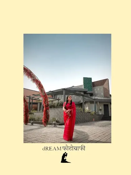 A wide shot of Ahana at her Haldi ceremony venue, showing the scale of the location and her striking red attire.