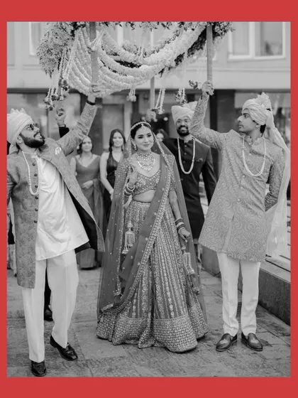 The same beautiful bridal entry, captured in timeless black and white. This format emphasizes the emotion and the grandness of the moment.
