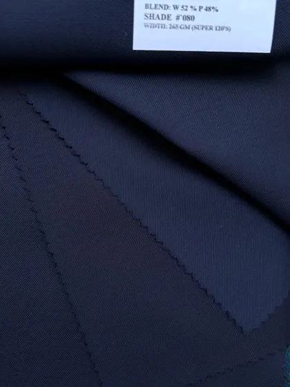 A swatch of a wool-polyester blend, a durable and versatile option for everyday suits. The label shows the composition, width, and weight, information we share for every fabric.
