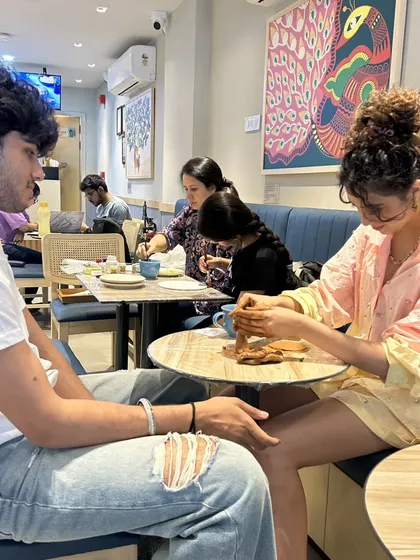 A candid moment from one of our workshops. It's about the experience, the conversation, and the joy of making something together.