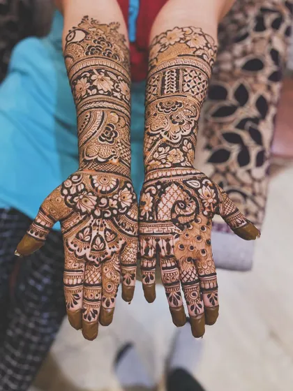 A beautiful example of a dense, traditional pattern without portraits. This design is full of intricate paisleys, flowers, and peacocks.