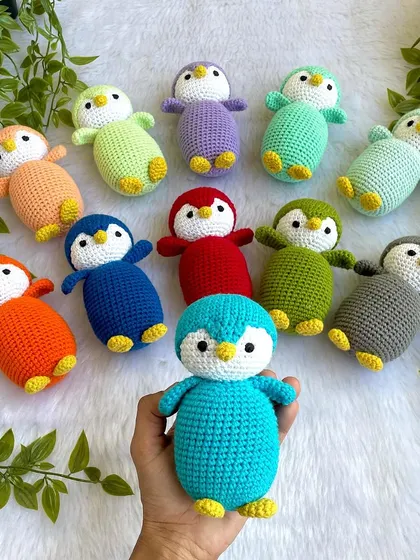 A rainbow of penguin babies! I made this colorful flock as return gifts for a birthday party. Each penguin is a different color, making them a unique and memorable party favor.