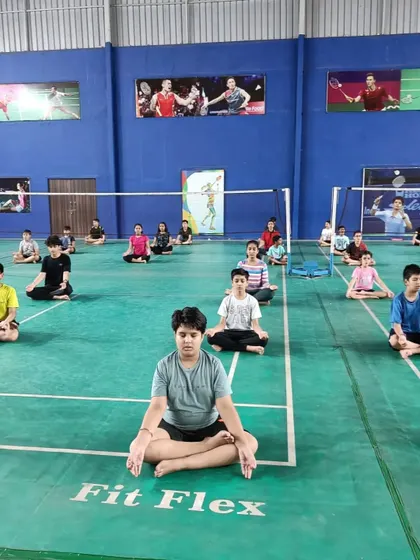 Another view of our yoga session on the court. Integrating mobility and flexibility training directly into our practice schedule ensures every player benefits from it.