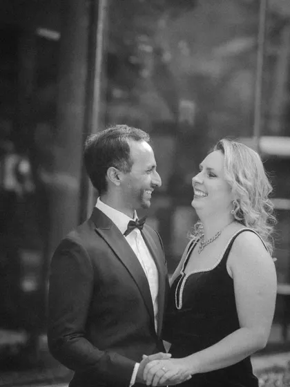A candid black and white shot filled with genuine laughter. This pre-wedding photo perfectly captures the fun and easygoing nature of their relationship.