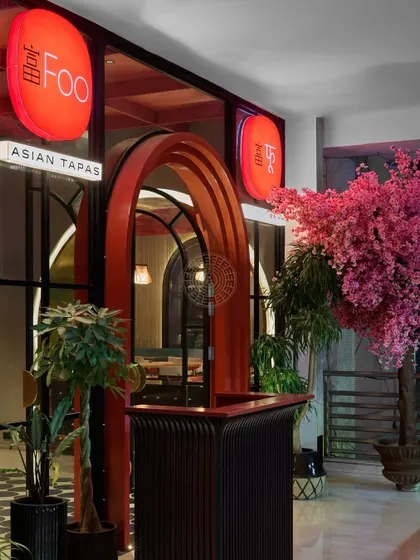 The entrance to Foo features a striking red archway and glowing lanterns, setting the stage for the modern Asian tapas experience inside.