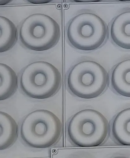 A multi-cavity silicone mold for making small donut-shaped soaps or wax melts. The uniform design is great for producing consistent batches.