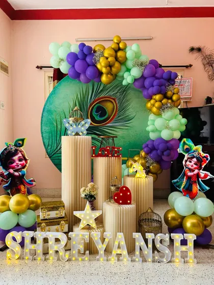 For a touch of tradition and fun, we offer a Little Krishna theme. This setup for Shreyansh includes a beautiful peacock feather backdrop, cutouts of baby Krishna, and a vibrant color scheme.