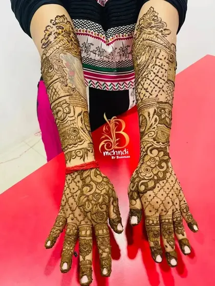 A full-arm design with a mix of styles, including a portrait element on one arm and traditional patterns on the other.