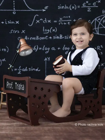 A playful moment at the professor's desk. We encourage kids to interact with the props for natural and candid shots.