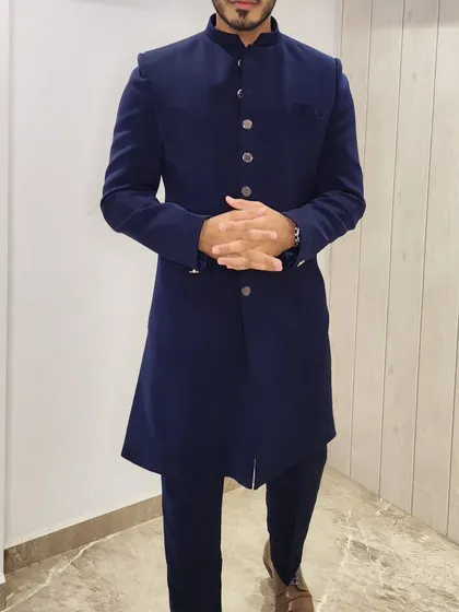 A client posing in the classic Navy Blue Nawabi kurta, a testament to its timeless appeal.