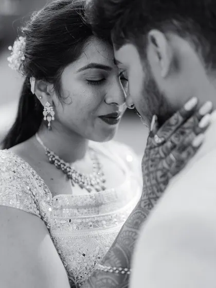 An intimate black and white close-up, focusing on the couple's connection. My photography aims to capture the quiet, powerful moments of love.