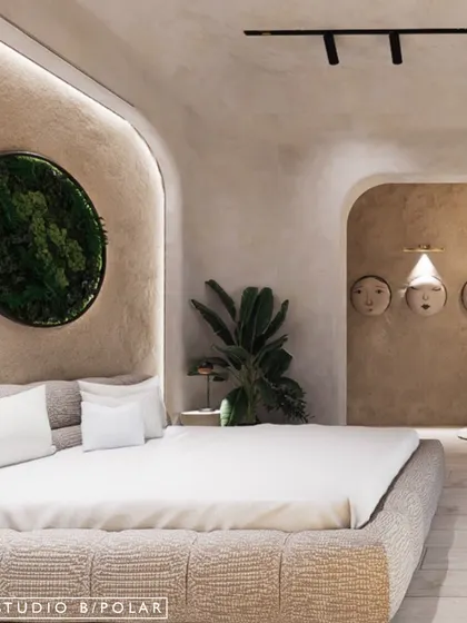 This bedroom in the La Lagune Penthouse is inspired by the Wabi-Sabi philosophy. The space features soft, curved arches, a neutral color palette, and natural textures to create a sanctuary of calm.